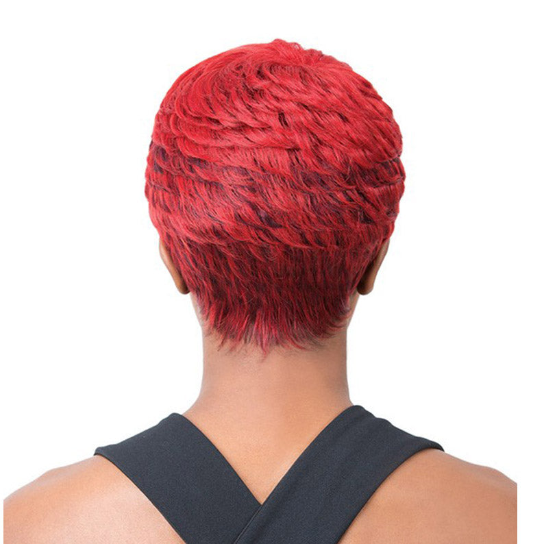 Back view of short vibrant red textured synthetic full cap wig styled in waves with tapered nape on model