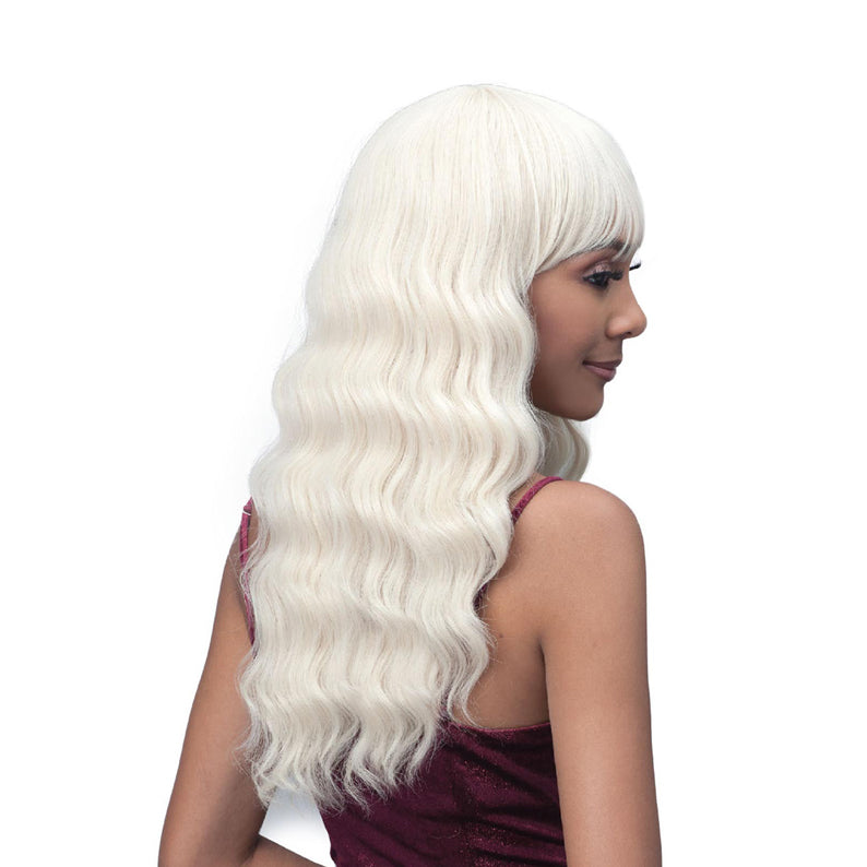 Bobbi Boss Briar synthetic wig long platinum waves with blunt bangs on model side profile for glam looks