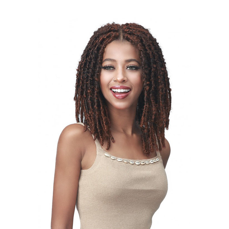 Model wearing BOBBI BOSS butterfly locs wig medium brown shoulder length with center part and natural texture