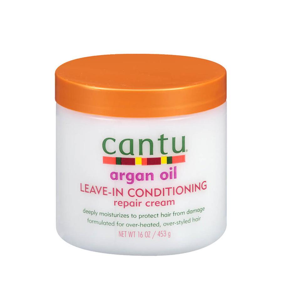 Cantu argan oil leave-in conditioner repair cream in a white jar with orange lid for hair care