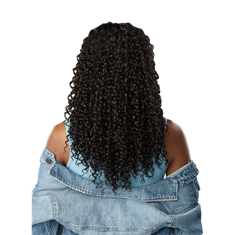 SENSATIONNEL textured clip in hair extensions shown on model with curly black hair and denim jacket