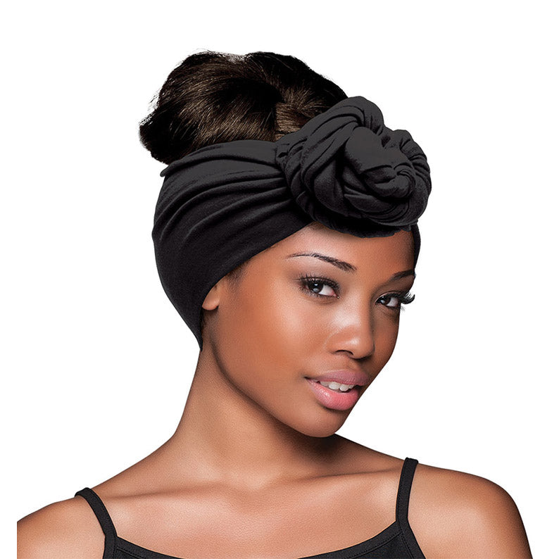 FIRSTLINE black wrap scarf for hair styled as knotted turban with bun at back for protective styling