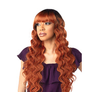 SENSATIONNEL synthetic long wavy wig with bangs in copper ginger with full blunt bangs and cascading waves
