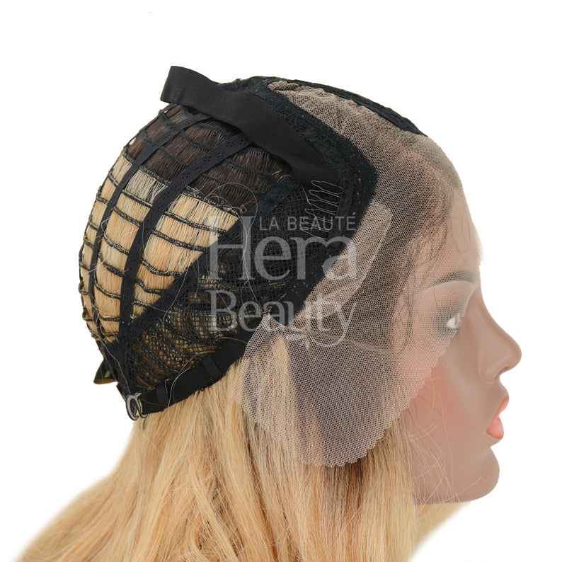 OUTRE melted hairline lace front wig on mannequin showing open cap construction and adjustable straps
