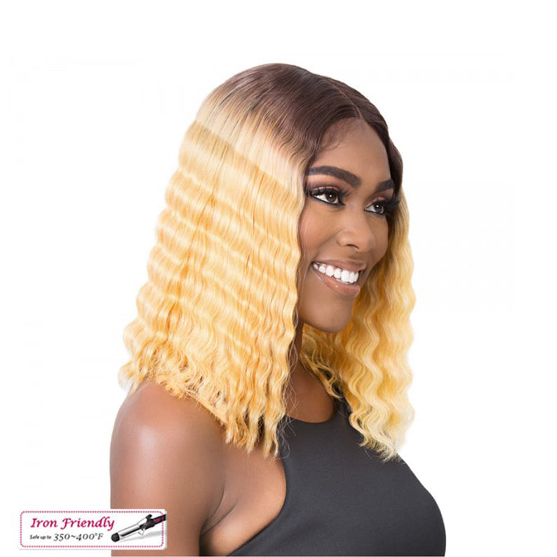 Smiling model wearing ITS A WIG HD lace front crimped wig honey blonde ombre shoulder length middle part