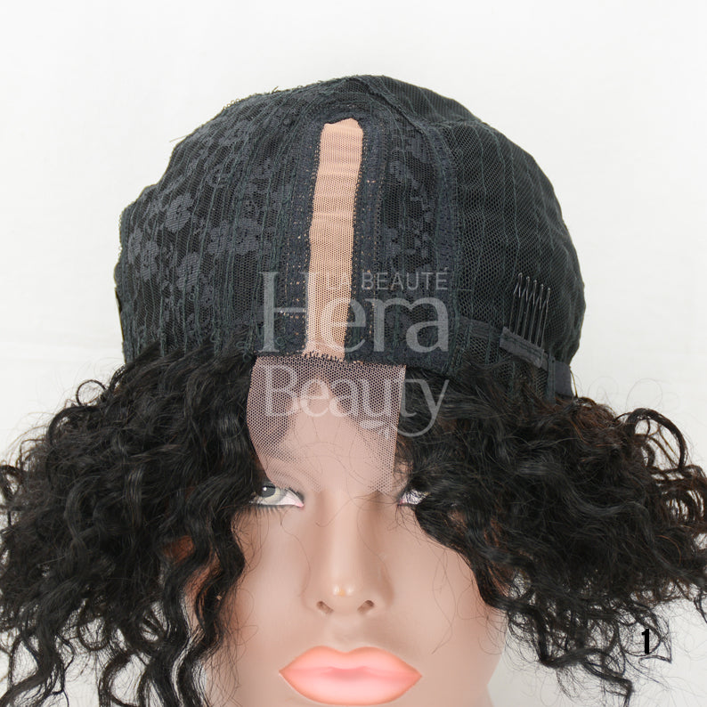 Mannequin head wearing a human hair T-part wig with black cap construction and curly dark brown hairline