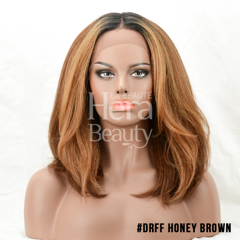 OUTRE soft natural synthetic lace front wig in honey brown shoulder length layered style on mannequin