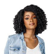 SENSATIONNEL black textured lace front wig with shoulder length curly texture on woman with denim jacket