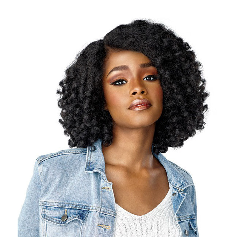 SENSATIONNEL black textured lace front wig with shoulder length curly texture on woman with denim jacket