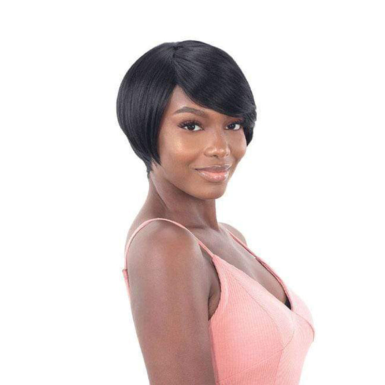 SHAKE N GO Freetress Equal synthetic wig short sleek black pixie with side swept bang on model in pink dress