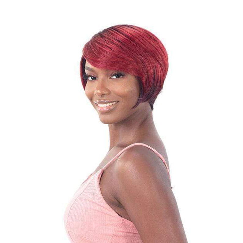 Model wearing SHAKE N GO Freetress Equal synthetic wig short red sleek bob with side swept bangs