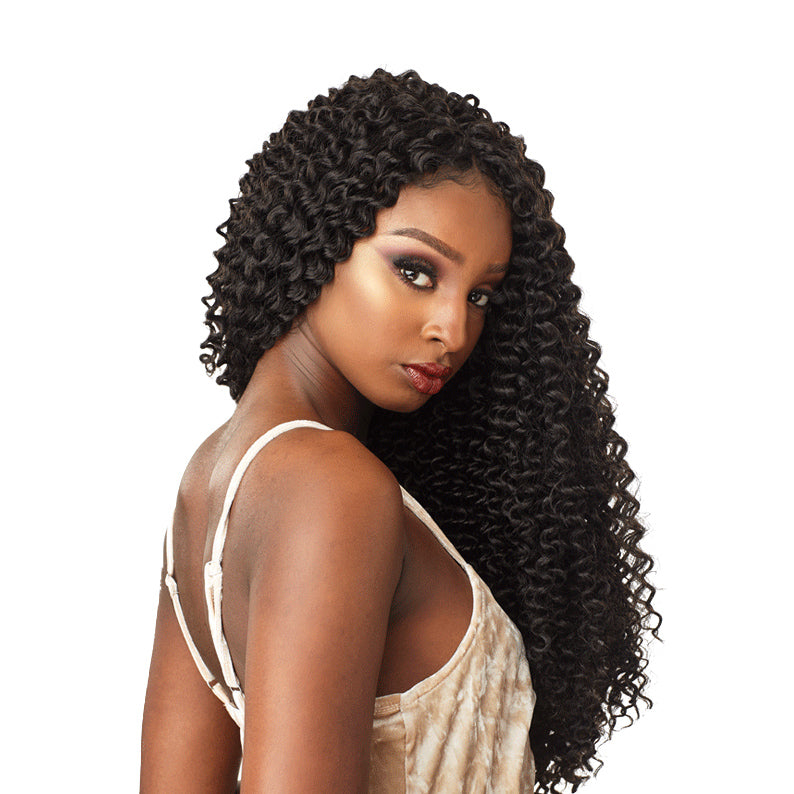 SENSATIONNEL Island Twist crochet braids in long curly style worn by a woman