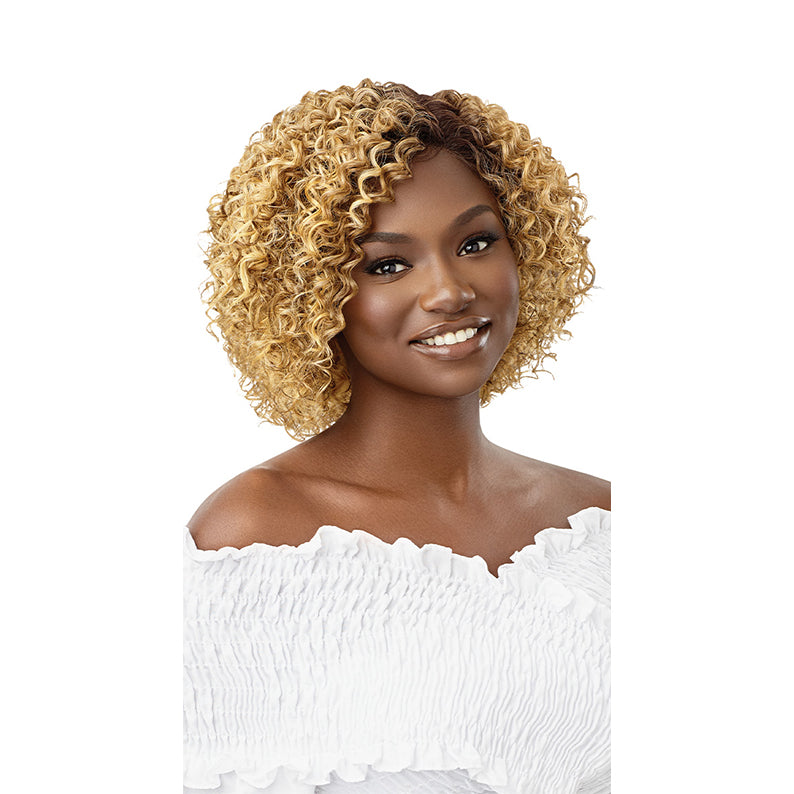 OUTRE synthetic lace front wig 10 inch curly honey blonde with dark roots on smiling model shoulder length