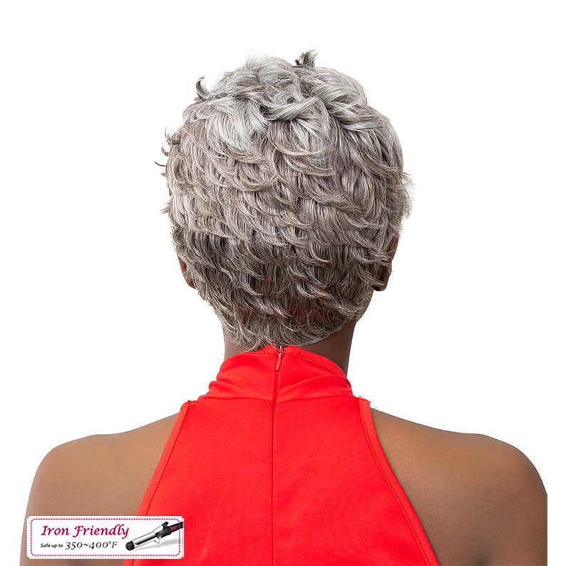 Back view of premium synthetic wig with short silver curls worn by model in red top