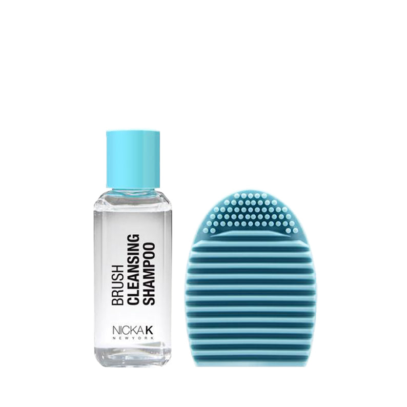 NICKA K makeup brush cleansing kit with clear brush cleansing shampoo bottle and blue silicone scrub pad