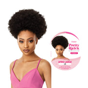 OUTRE Afro ponytail extension in afro large 1B style worn by woman with natural curly hair