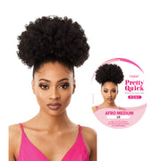 OUTRE Afro puff ponytail extension in afro medium 1B worn by model with natural curly hair