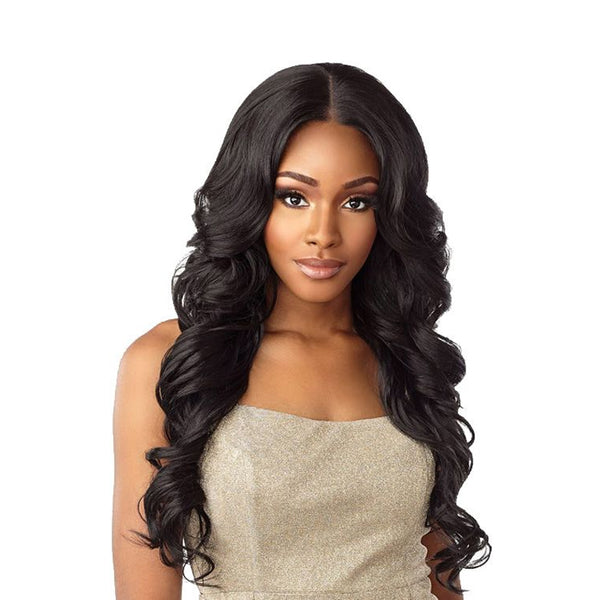 SENSATIONNEL Butta Lace Unit 20 wig on model long wavy black hair with center part natural volume and shine
