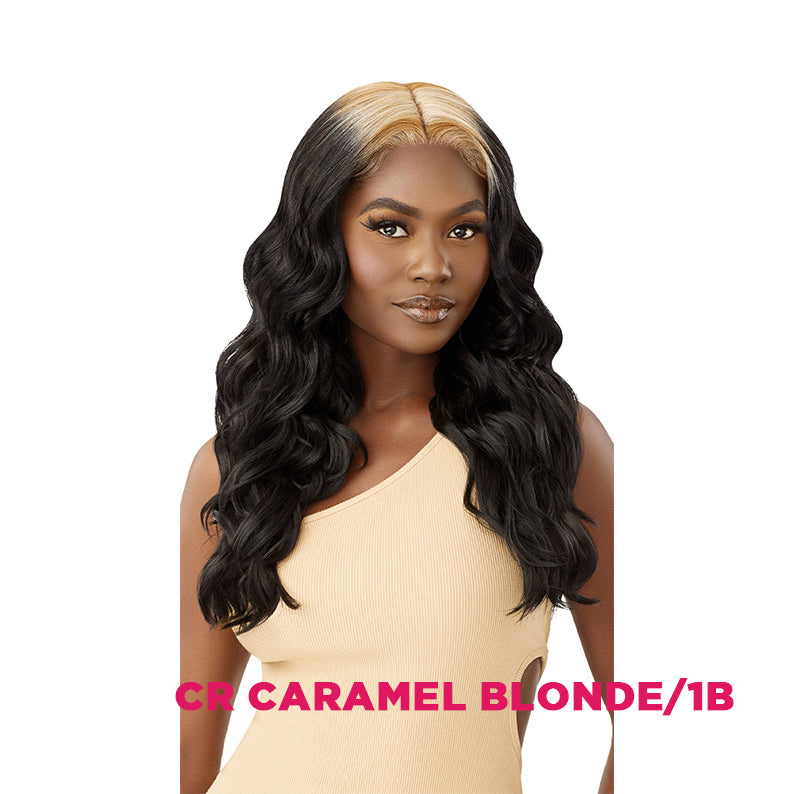 OUTRE model wearing COLORBOMB synthetic lace front wig in CR Caramel Blonde 1B long wavy middle part