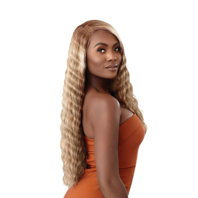 OUTRE lace front synthetic wig 28 inch honey blonde long wavy style with natural side part on model