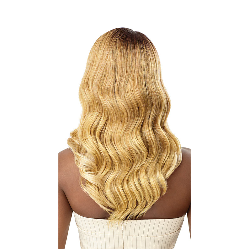 OUTRE lace front synthetic wig Ryella honey blonde with dark roots long wavy back view on model