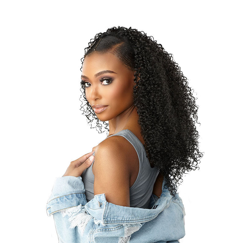 SENSATIONNEL 14 inch clip-in hair extensions in curly black worn by a woman with denim jacket