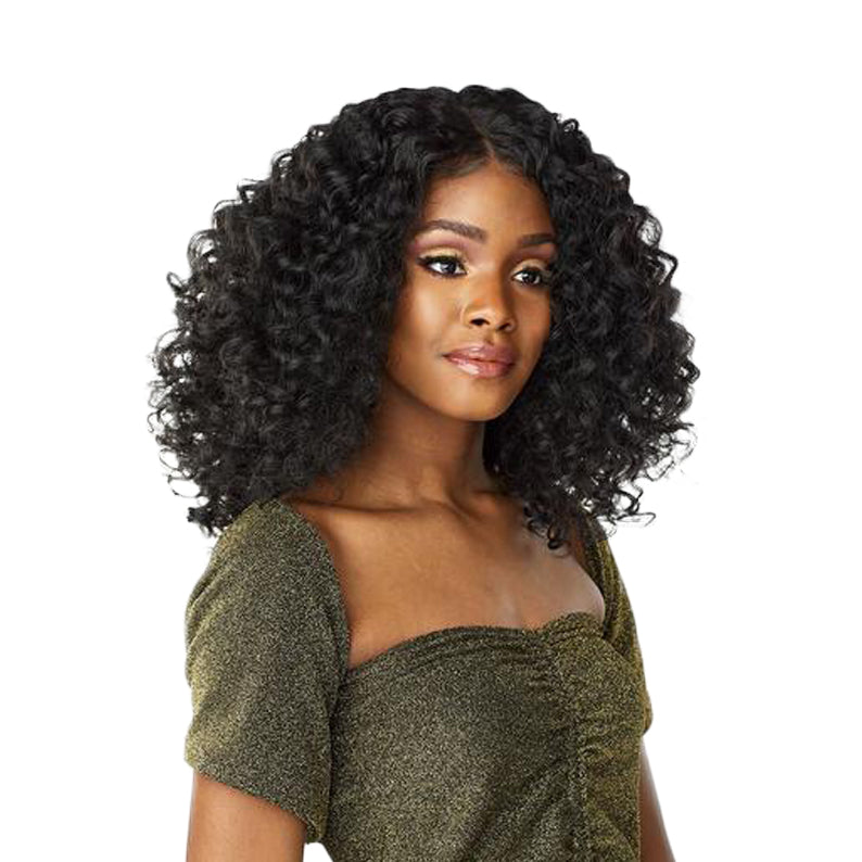 SENSATIONNEL Butta Lace Unit 5 wig shoulder length deep curly black on model for voluminous natural look
