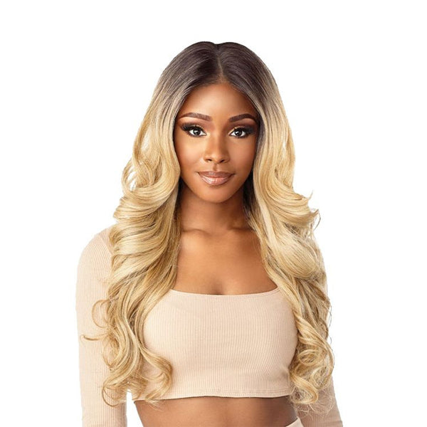 Model wearing Sensationnel Cloud 9 Rashana HD lace wig long blonde ombre waves with natural center part and lace hairline