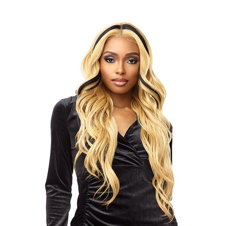 Model wearing Sensationnel Vice Unit 12 lace front wig long wavy honey blonde with black streaks
