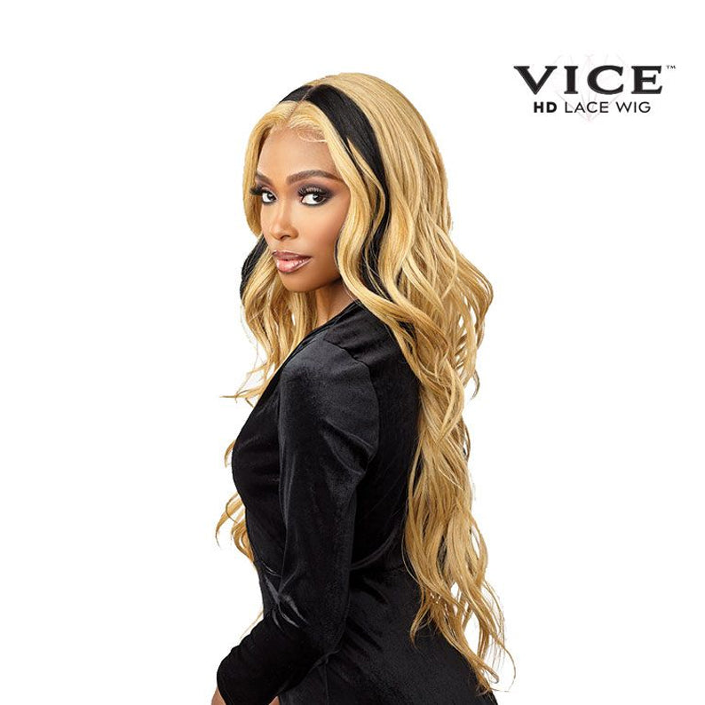 Model wearing Sensationnel Vice Unit 12 lace front wig. Long honey blonde waves with dark root center part