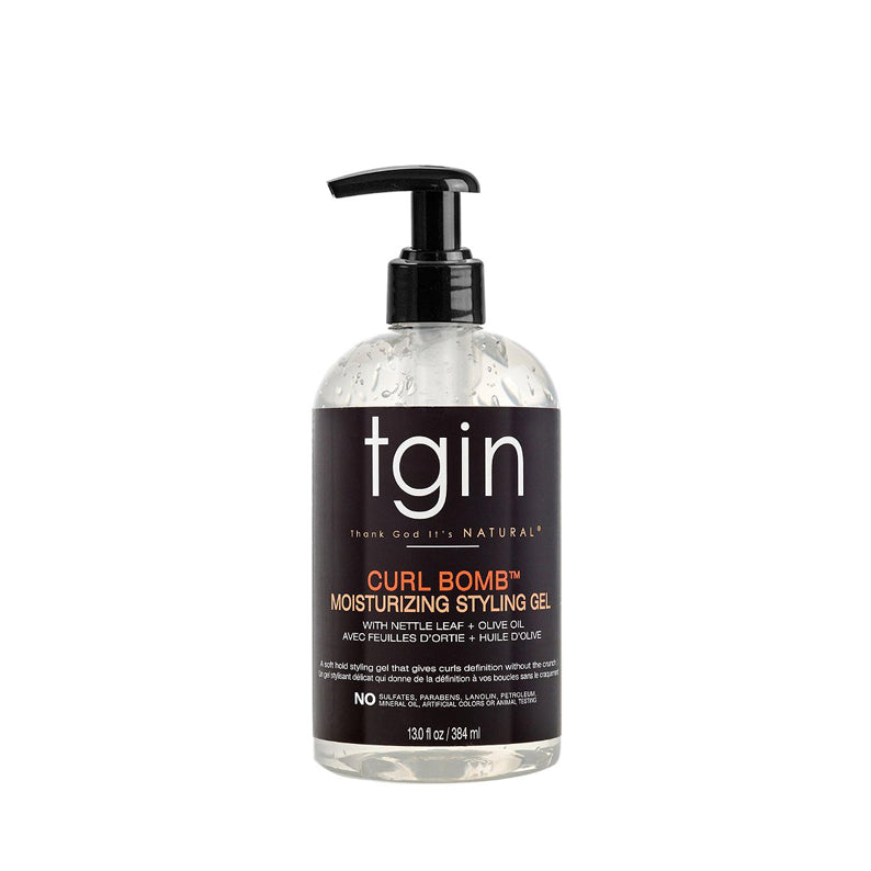 Clear pump bottle of tgin curl bomb styling gel moisturizing formula for defined curly hair