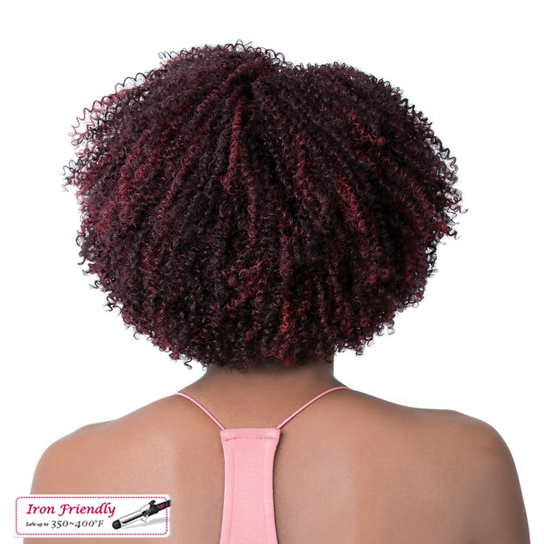Back view of model wearing burgundy and black coily synthetic wig with tight curls and short afro shape