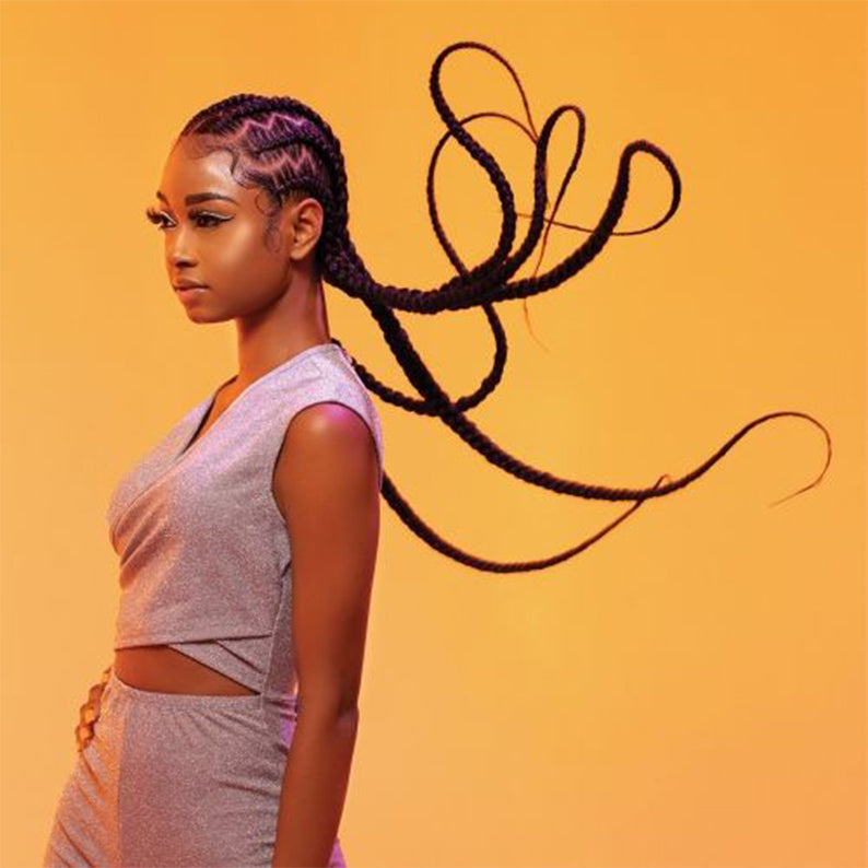 SENSATIONNEL braid on model with cornrows and long flowing pre-stretched braiding hair 58 inch on orange